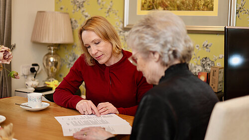 Helen helping a local resident