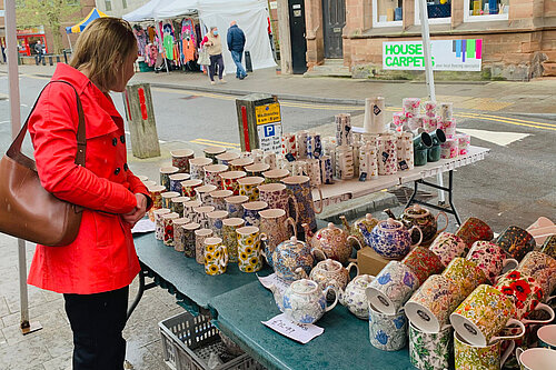 Helen browsing at a local market