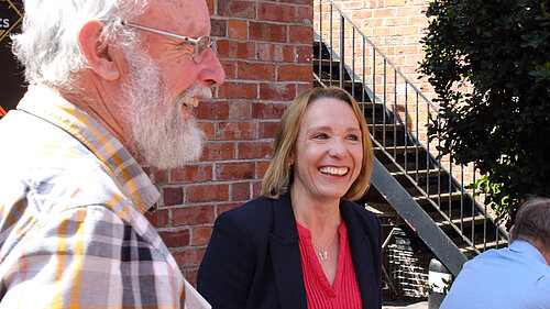 Helen talking to a local pensioner