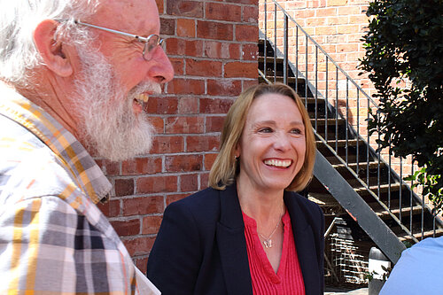 Helen talking to a local pensioner