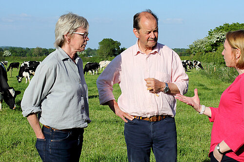 Helen talking to farmers on a North Shropshire farm