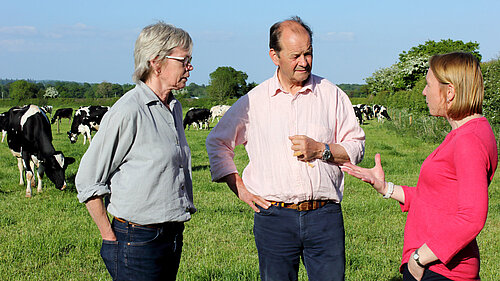 Helen talking to farmers on a North Shropshire farm