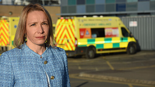 Helen Morgan with a local ambulance