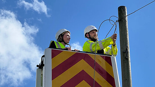 Helen Morgan with a broadband engineeer