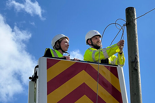 Helen Morgan with a broadband engineeer