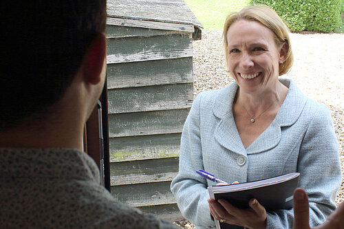 Helen speaking to a resident on their doorstep