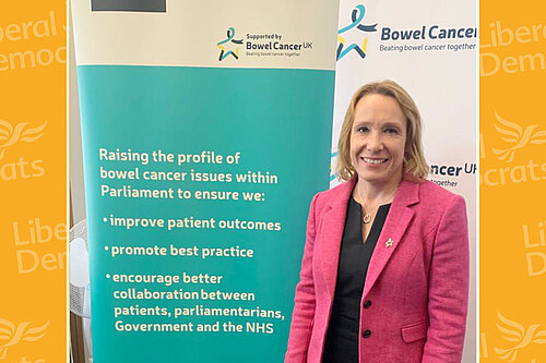 Helen with Bowel Cancer UK banner