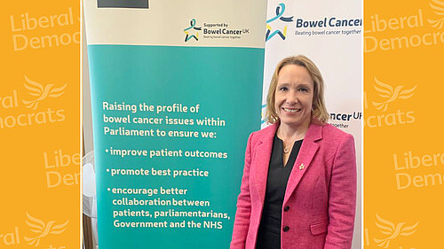 Helen with Bowel Cancer UK banner