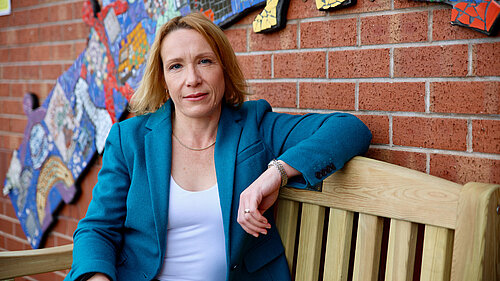 Helen Morgan MP sitting on a bench in North Shropshire