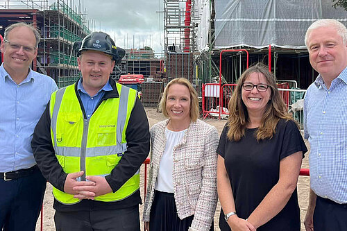 Helen with doctors and construction staff at Pauls Moss house