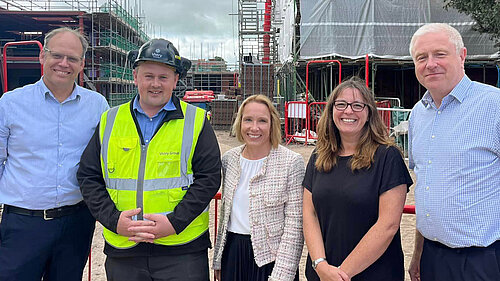 Helen with doctors and construction staff at Pauls Moss house