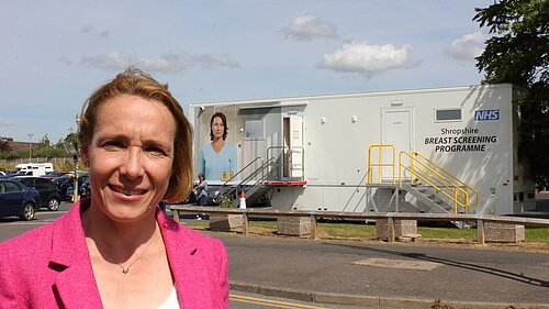 Helen Morgan with a mobile breast screening unit