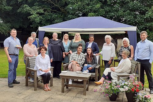 Helen with staff at a local care home