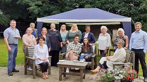 Helen with staff at a local care home