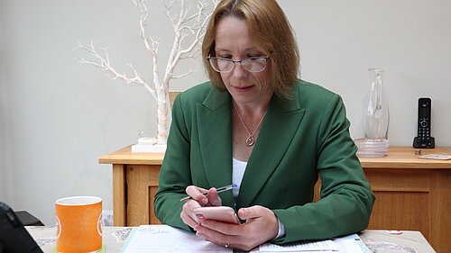 Helen at her desk