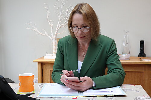 Helen at her desk