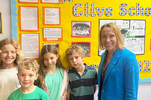 Helen with children at Clive Primary School