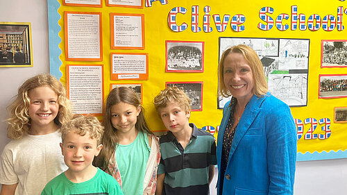 Helen with children at Clive Primary School