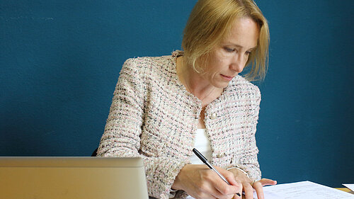Helen at her desk