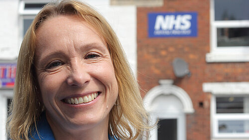 Helen outside an NHS provider